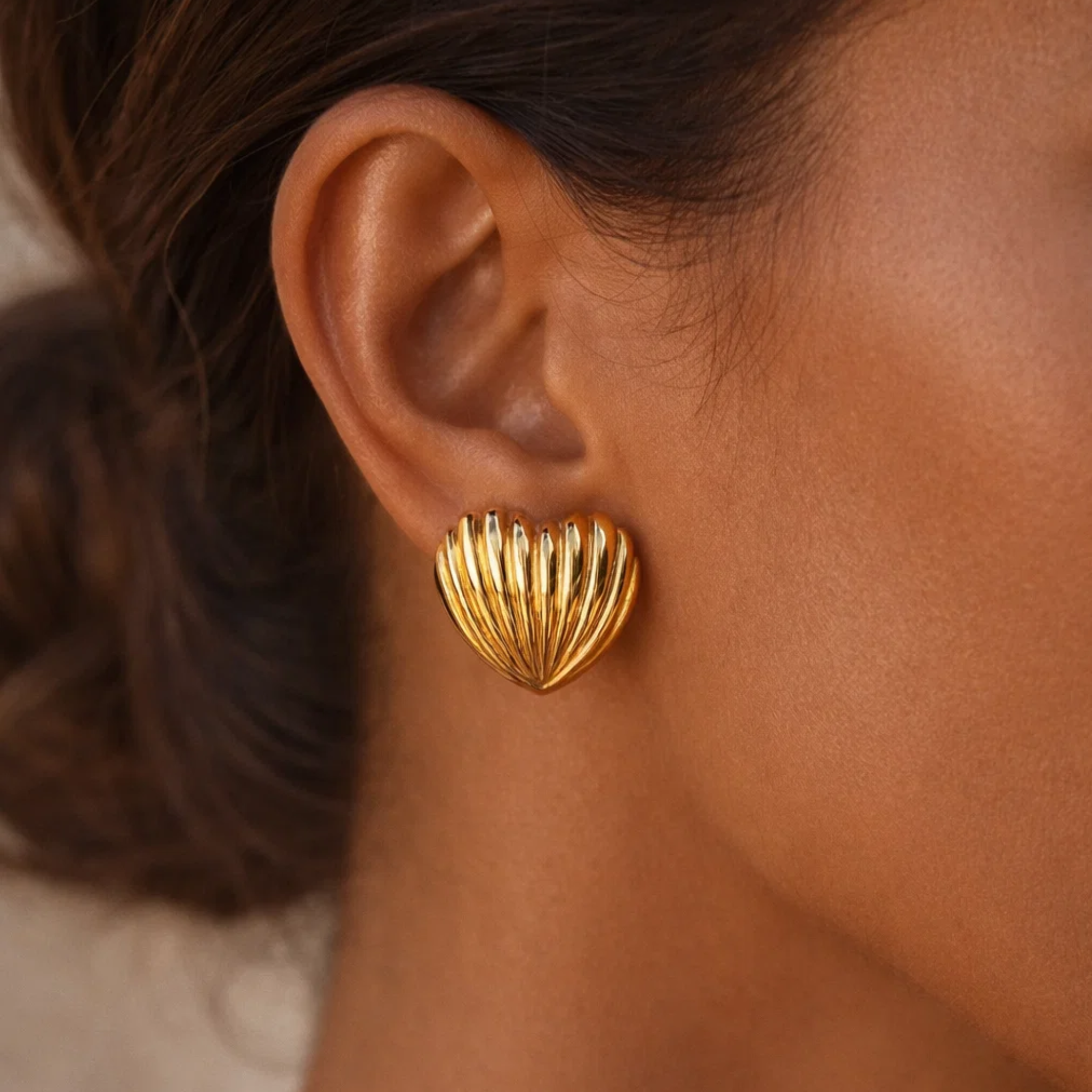 A woman wearing shell earrings