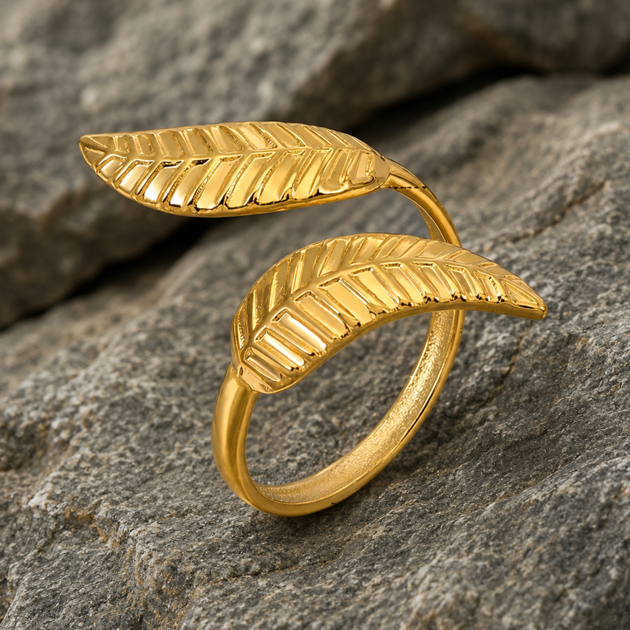 A gold ring with leaf shape on a rock background