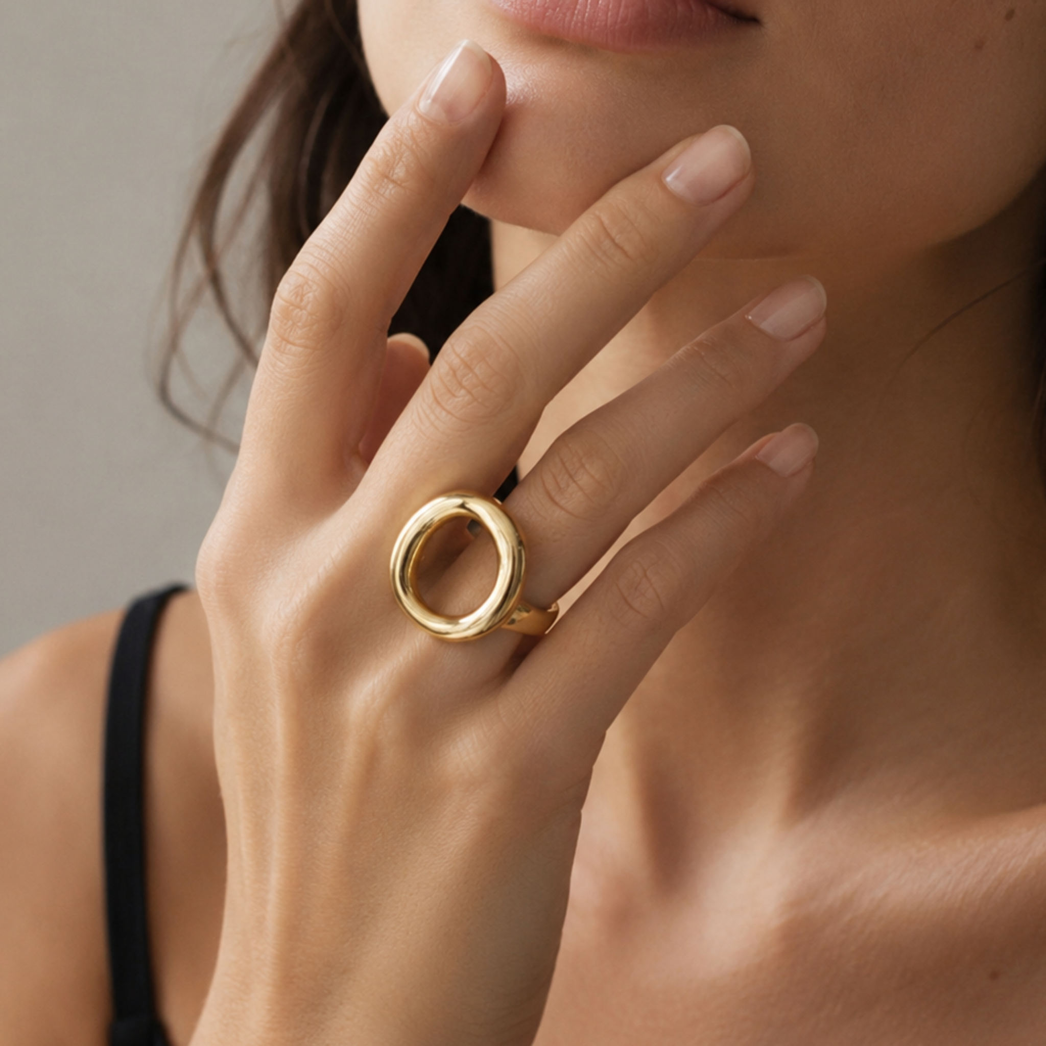 A model wearing a circular ring