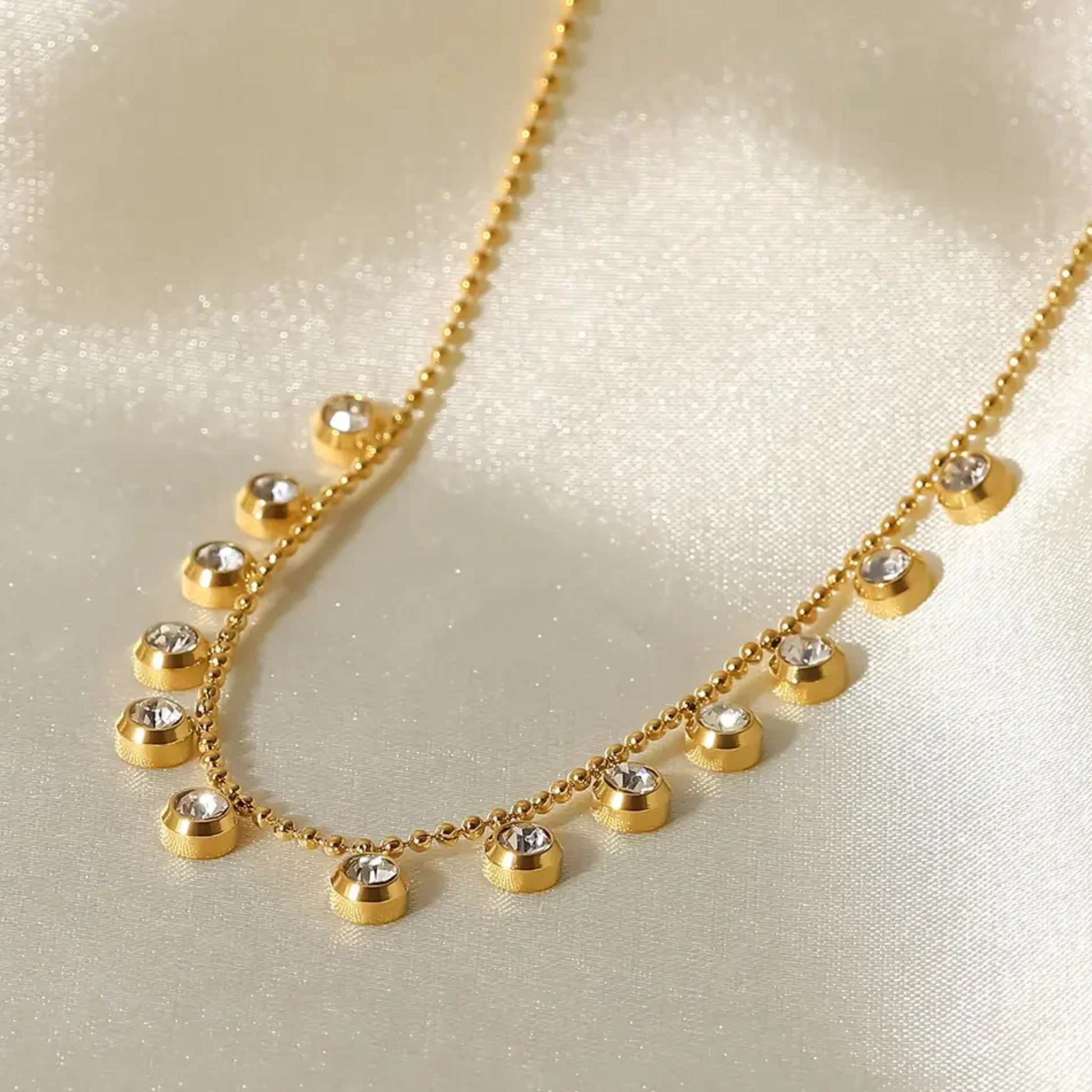 Gold necklace with small round beads and crystals 