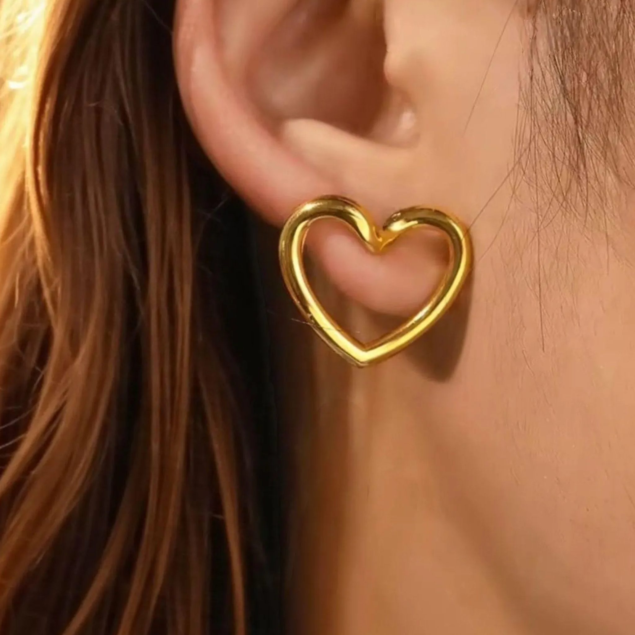 A woman wearing a casual heart earring