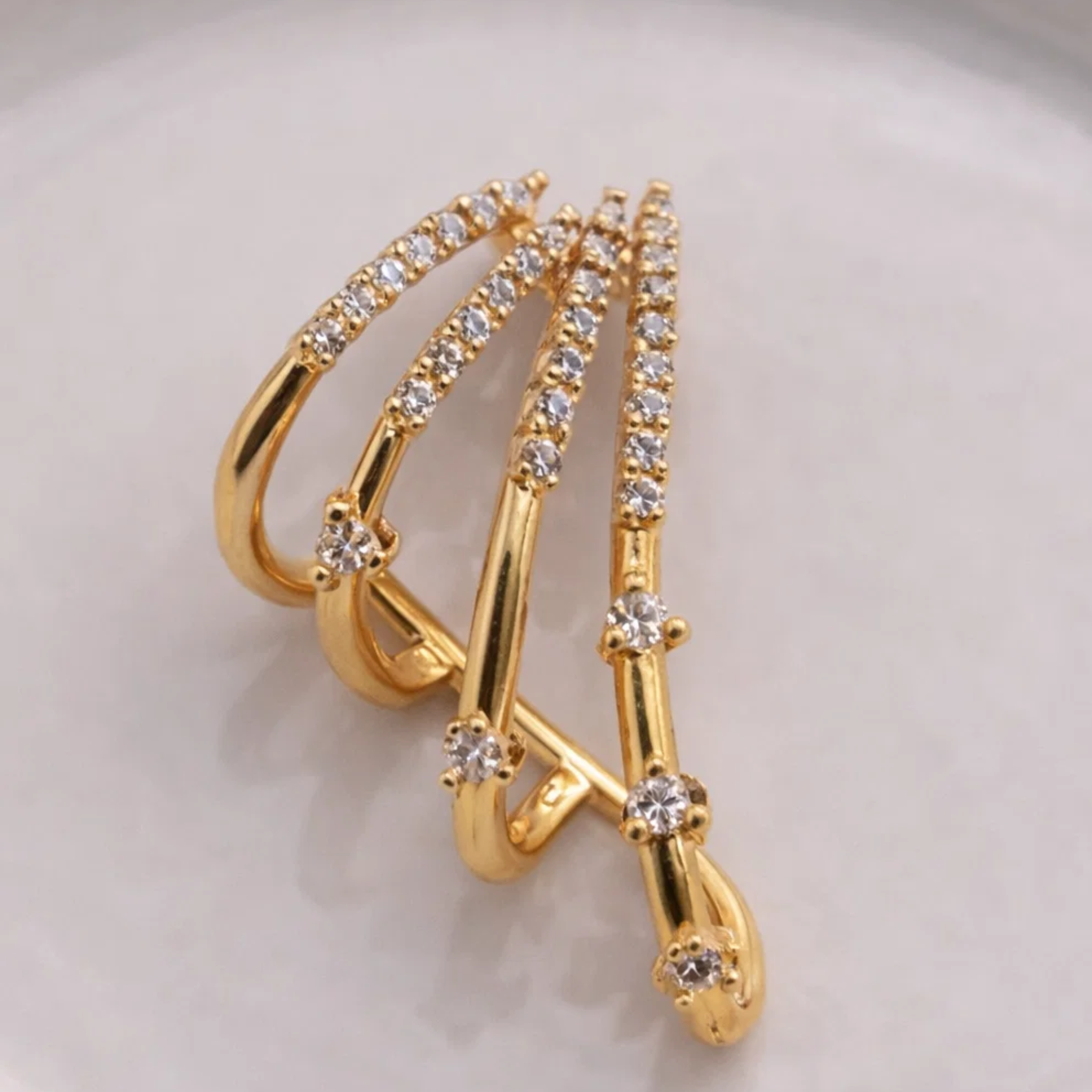 Gold ring with embedded gemstones on it