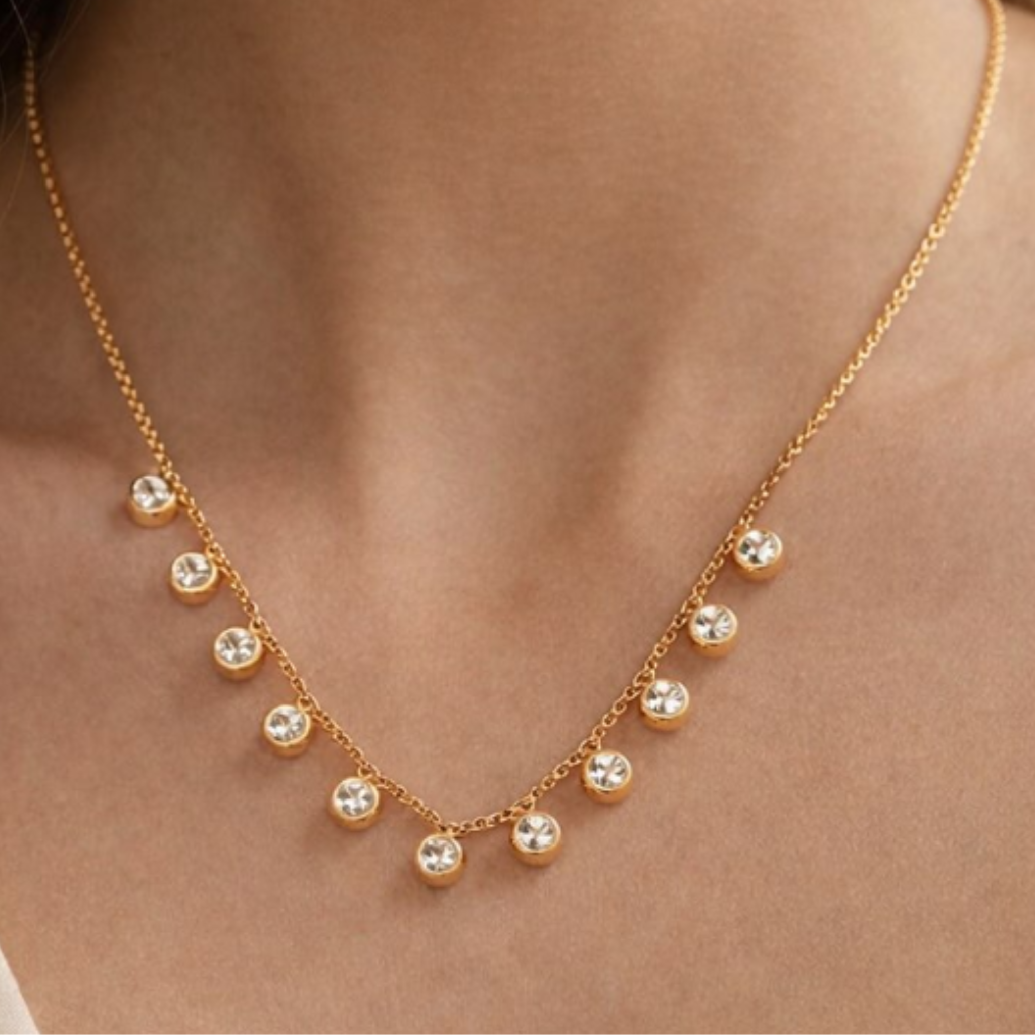 A woman wearing a timeless crystal necklace