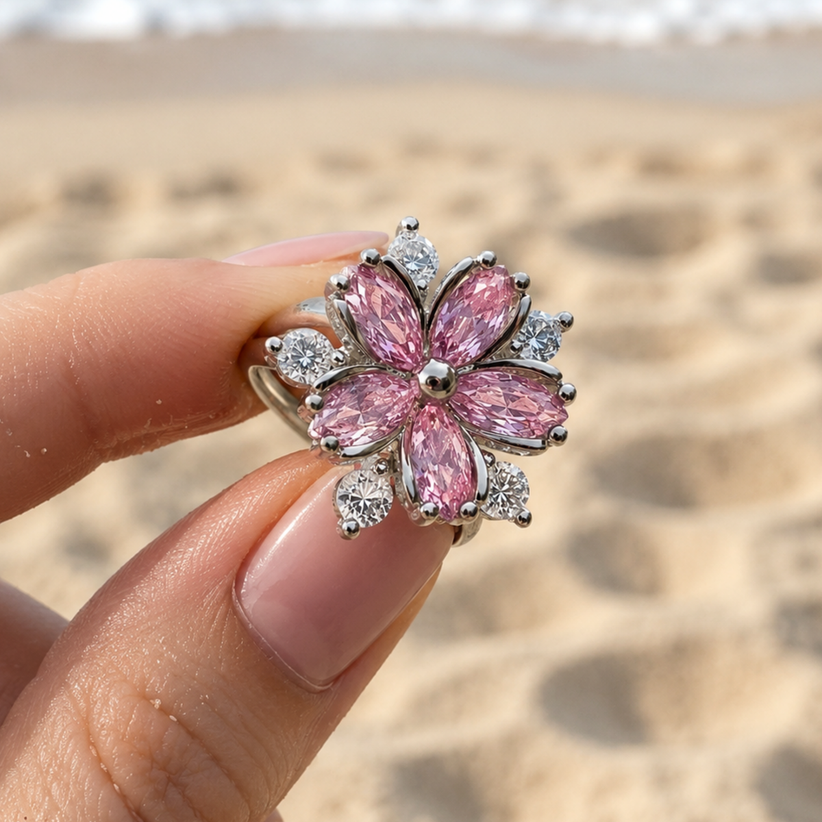 A pink flower ring held by a woman