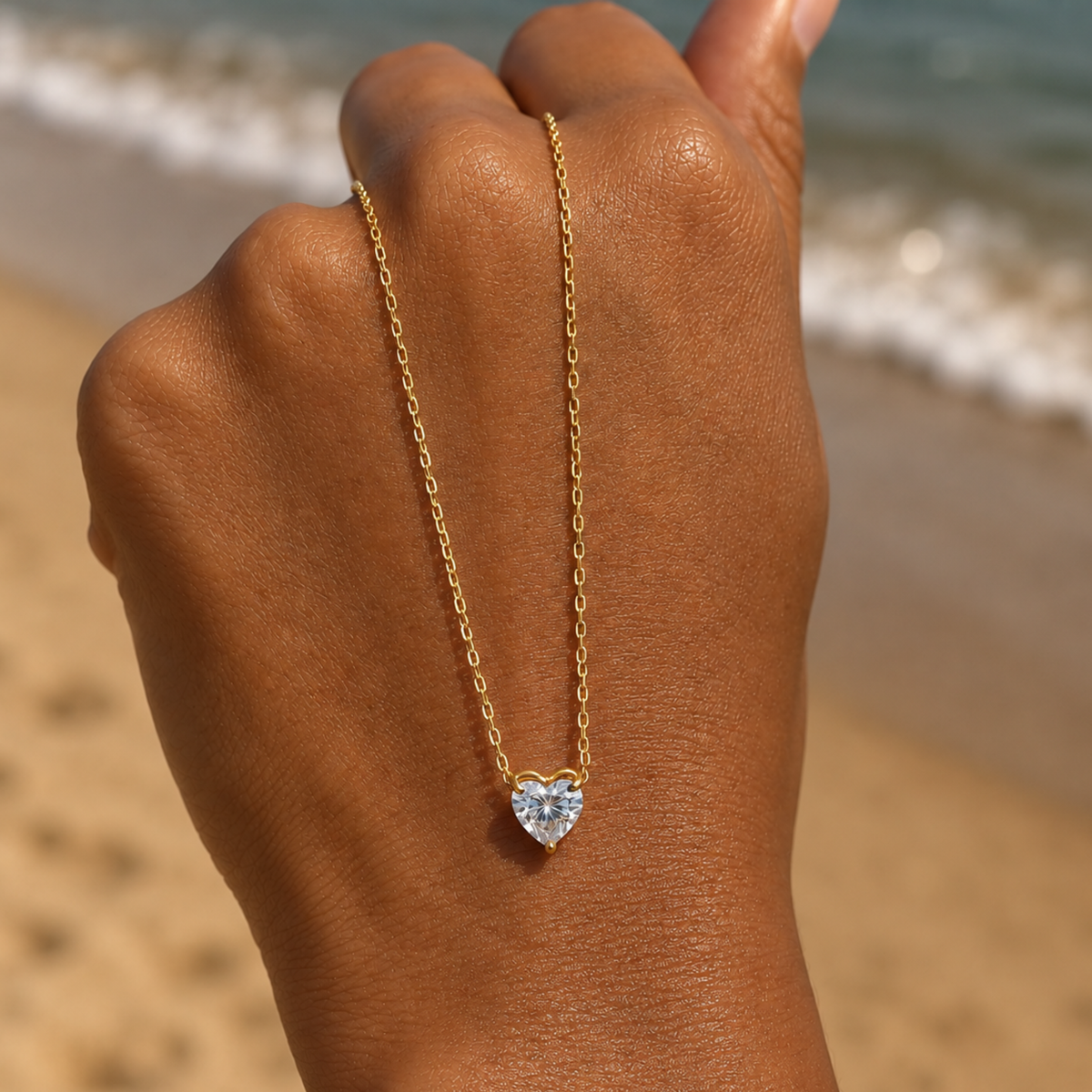 A zircon heart-shaped pendant held by a lady