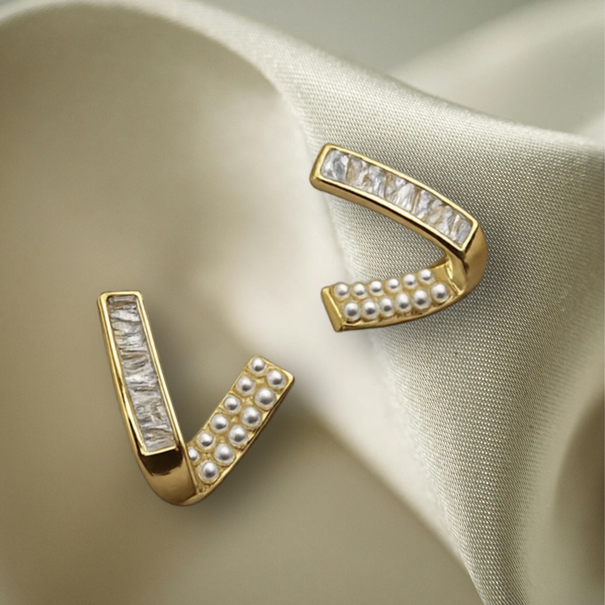 Gold earrings with pearl and crystal accents 