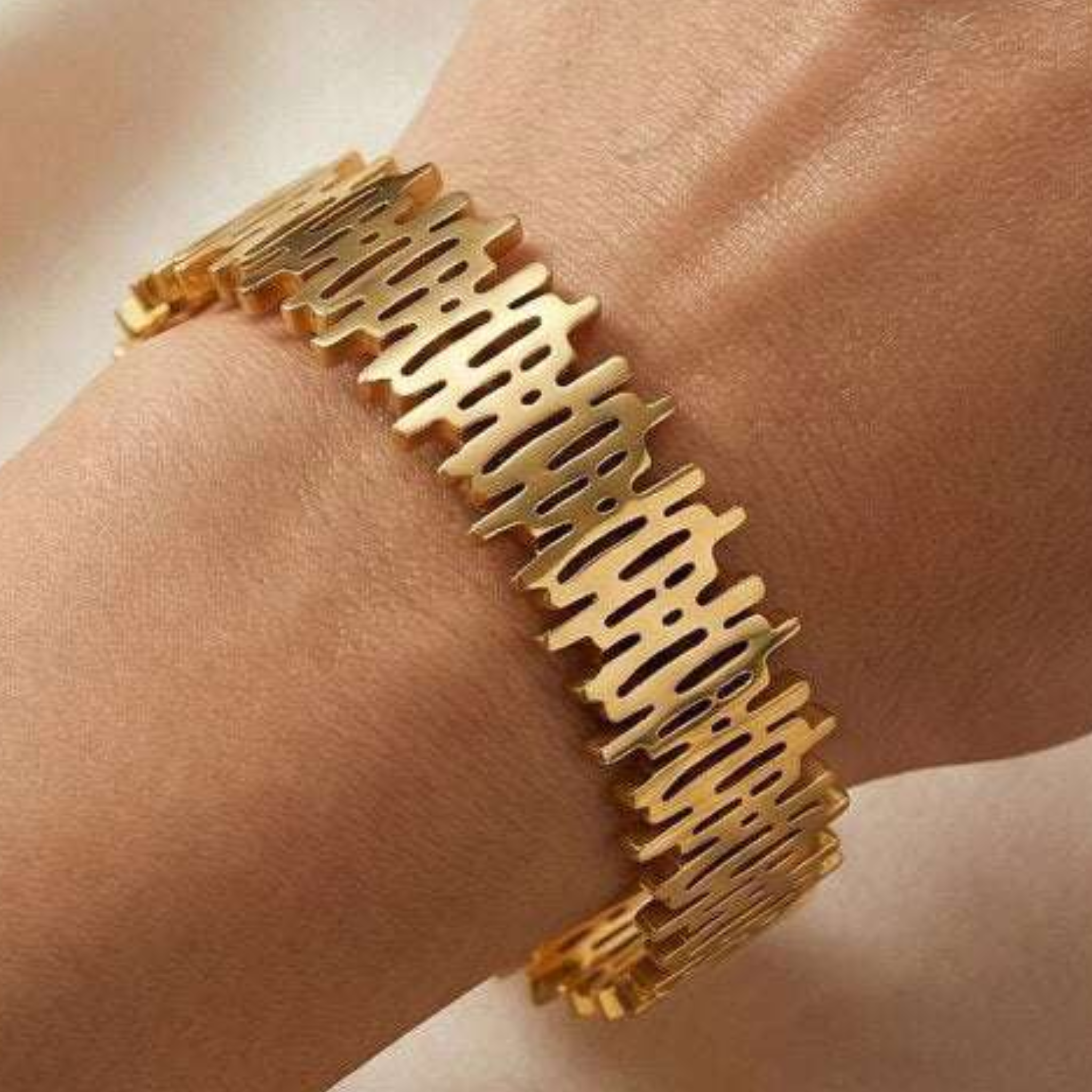 A woman wearing a gold bangle 