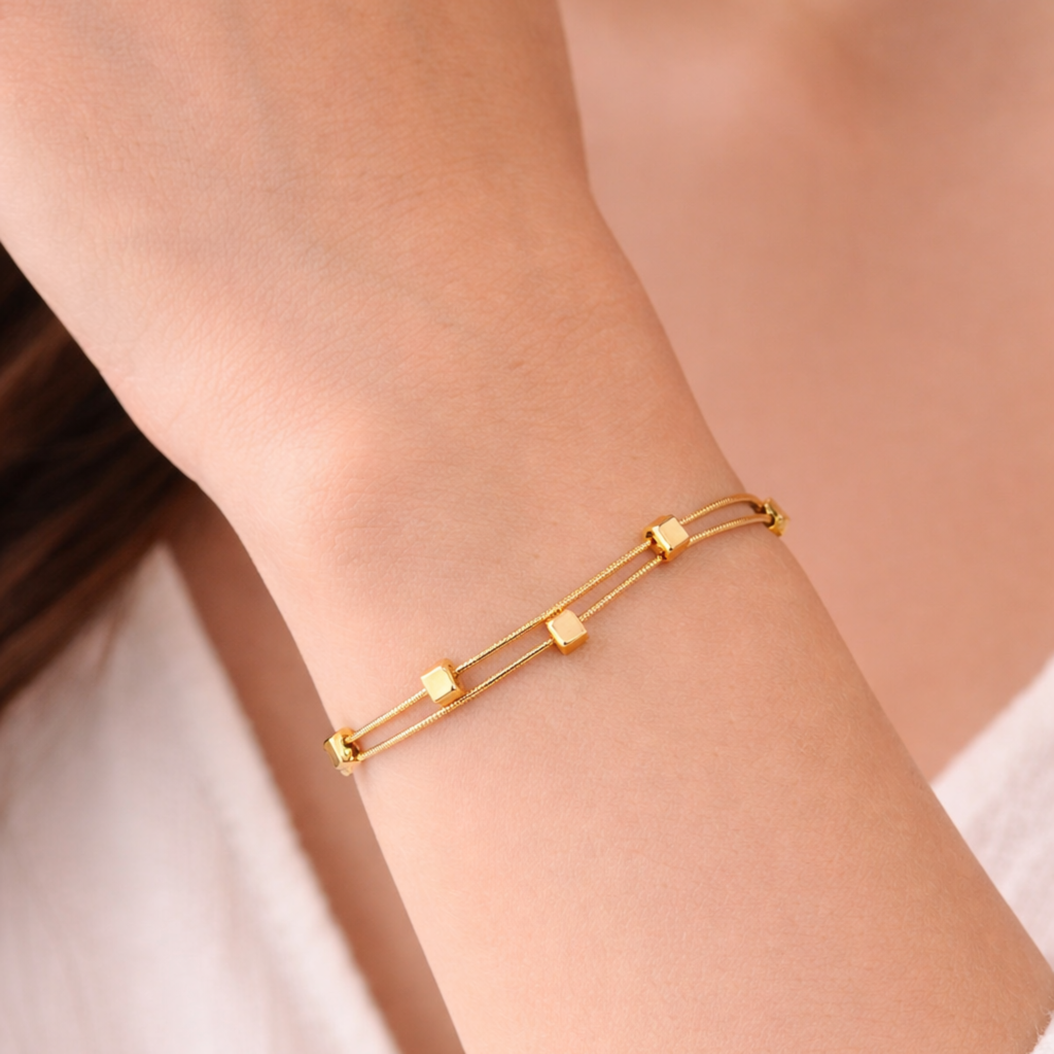 Gold bracelet on a person's wrist 