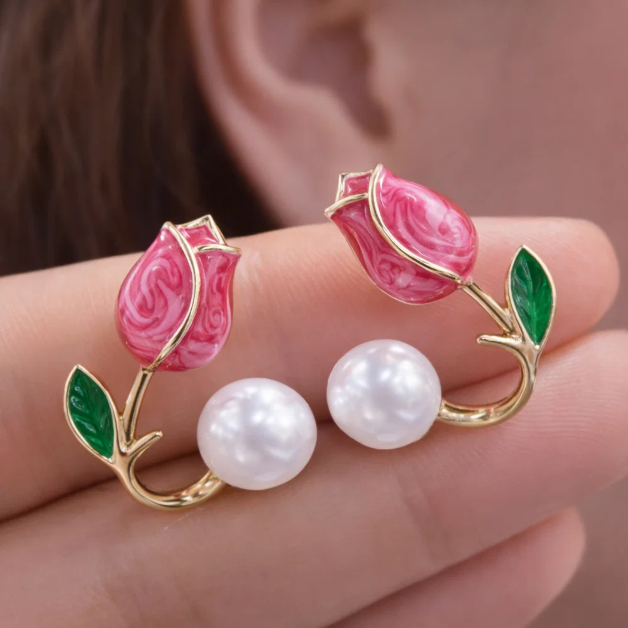 Pink tulip-shaped earrings with pearl centers 
