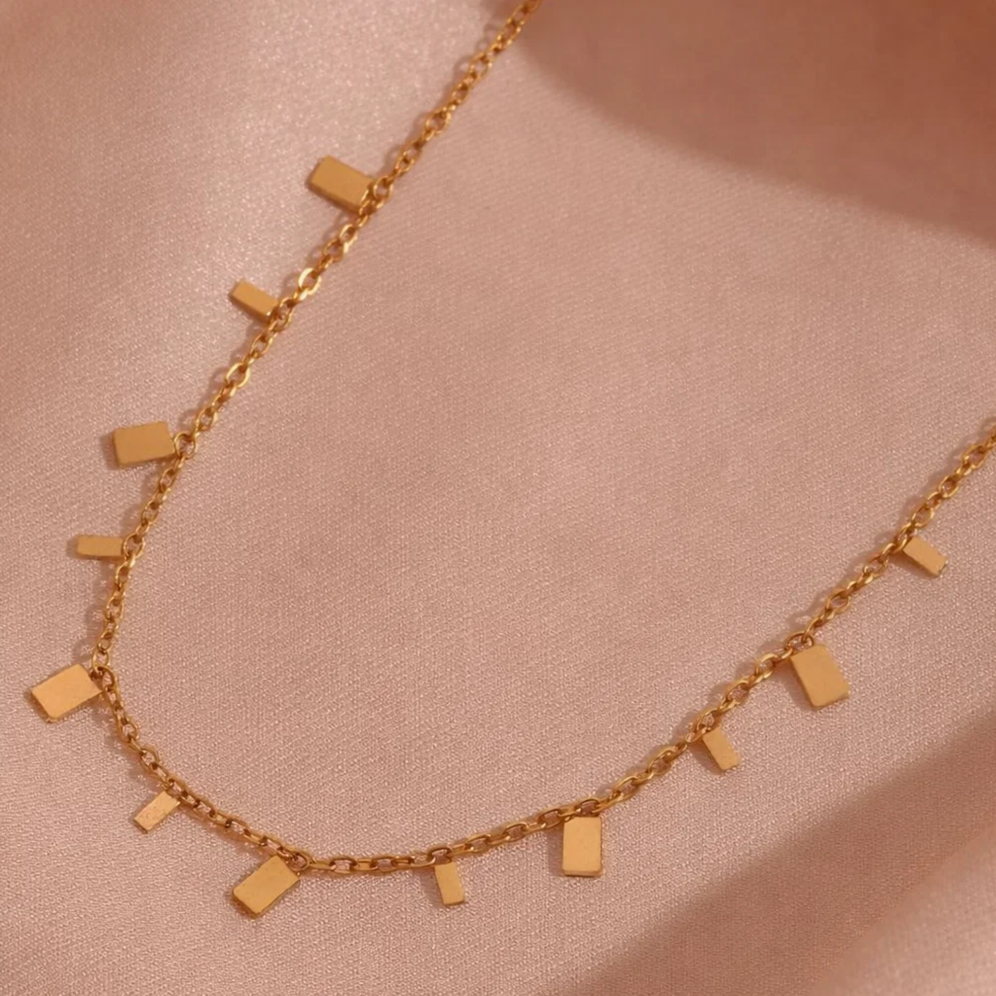 Gold necklace with rectangular pendants 