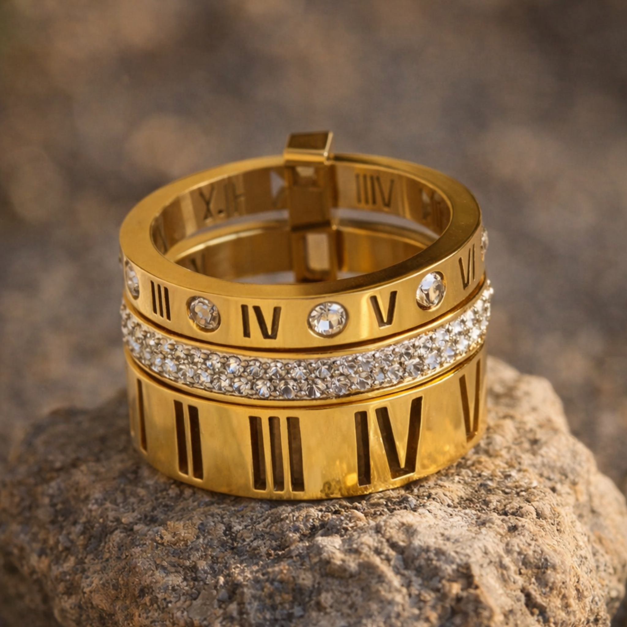 Gold ring with Roman numeral on a stone surface