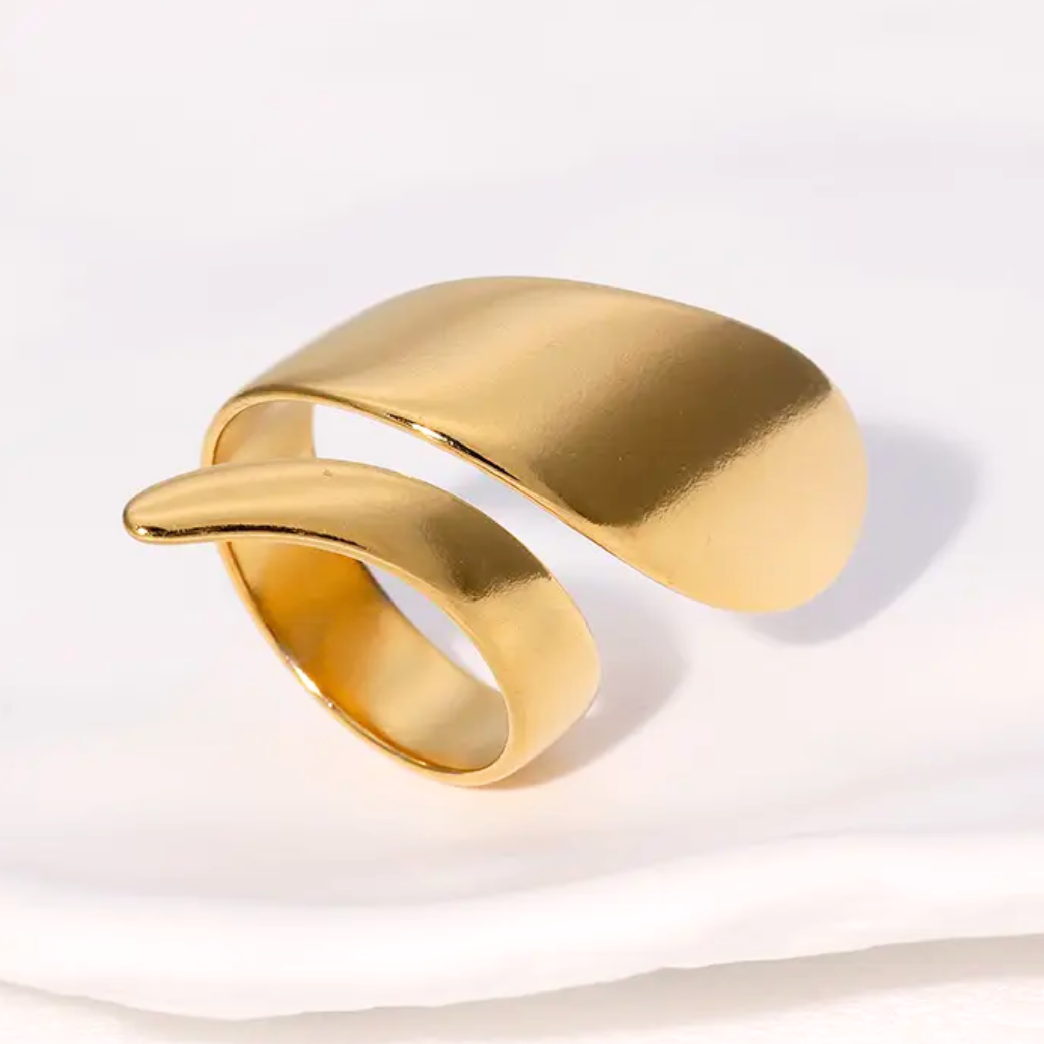 A spiral ring laid on a white surface