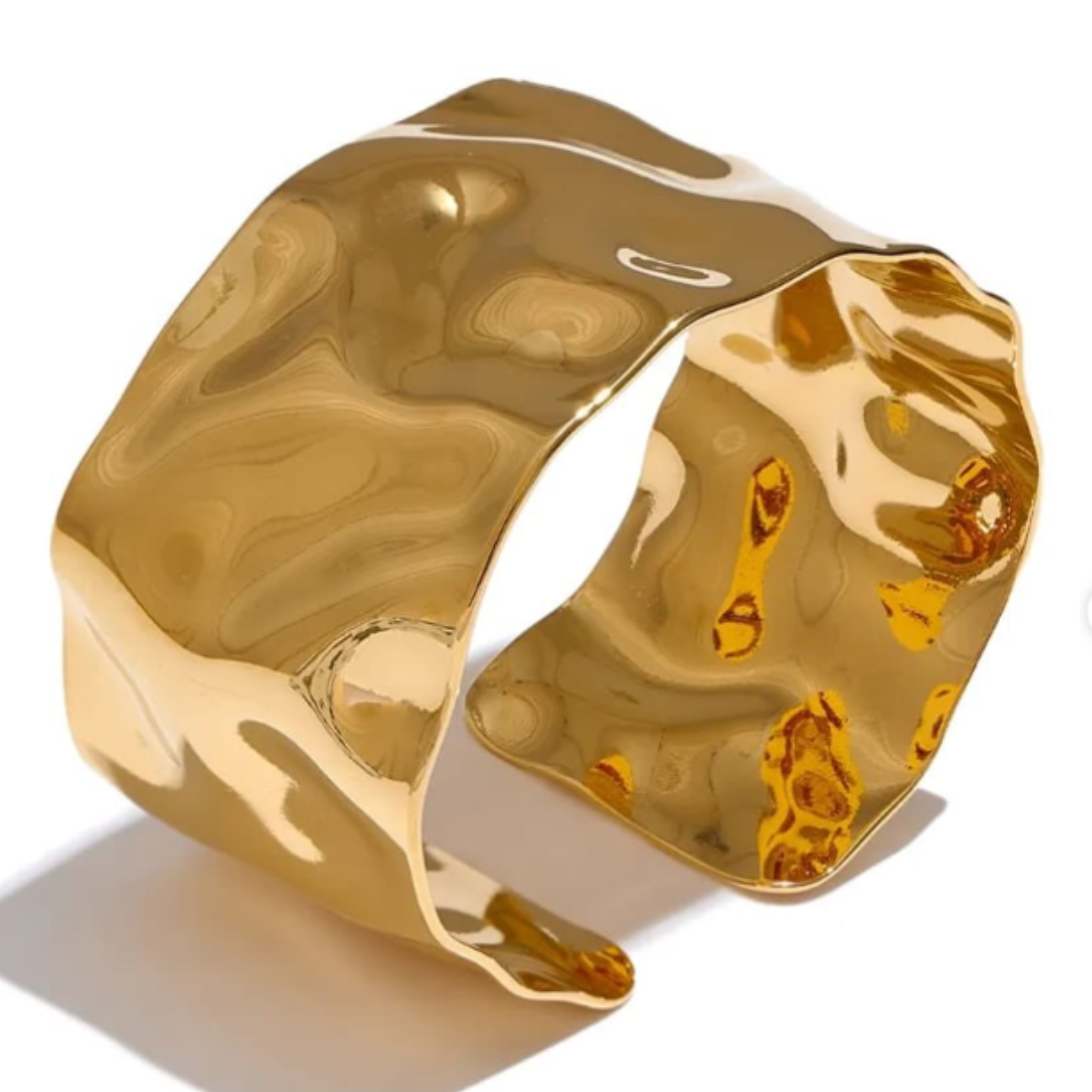 Gold cuff bangle with a marbled texture 