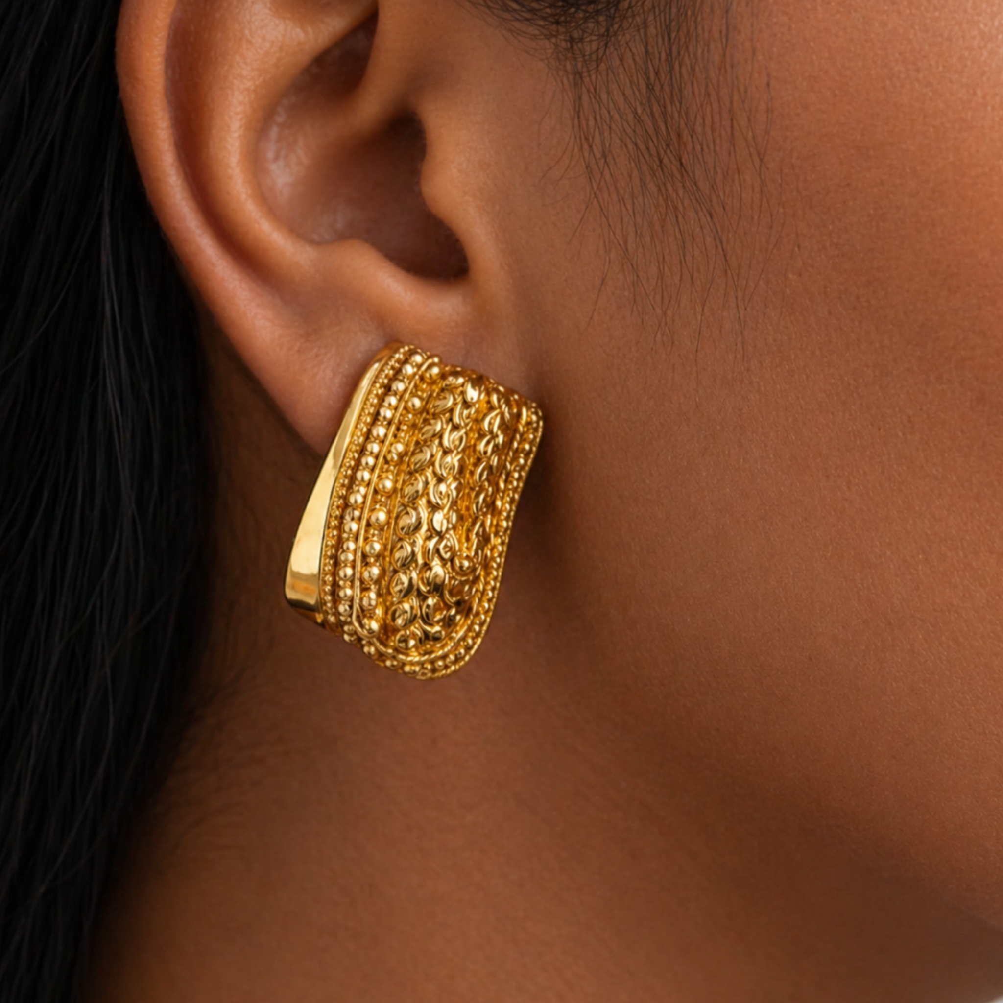 A woman wearing textured earring 