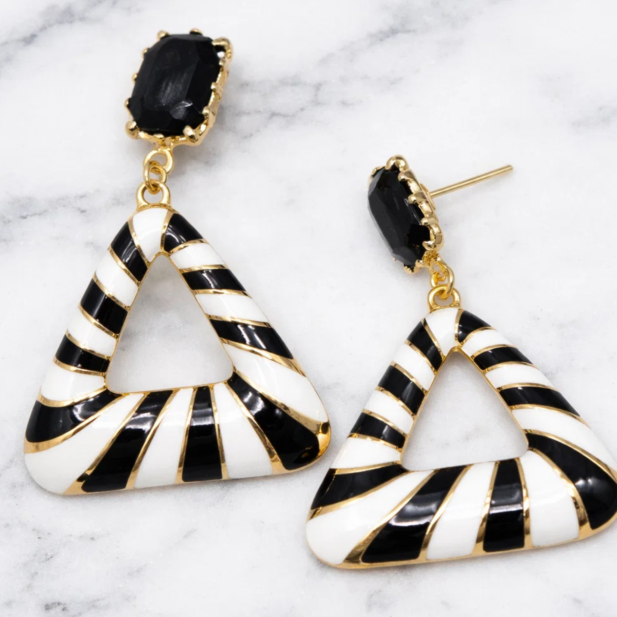 Black and white striped earrings with gold accents 