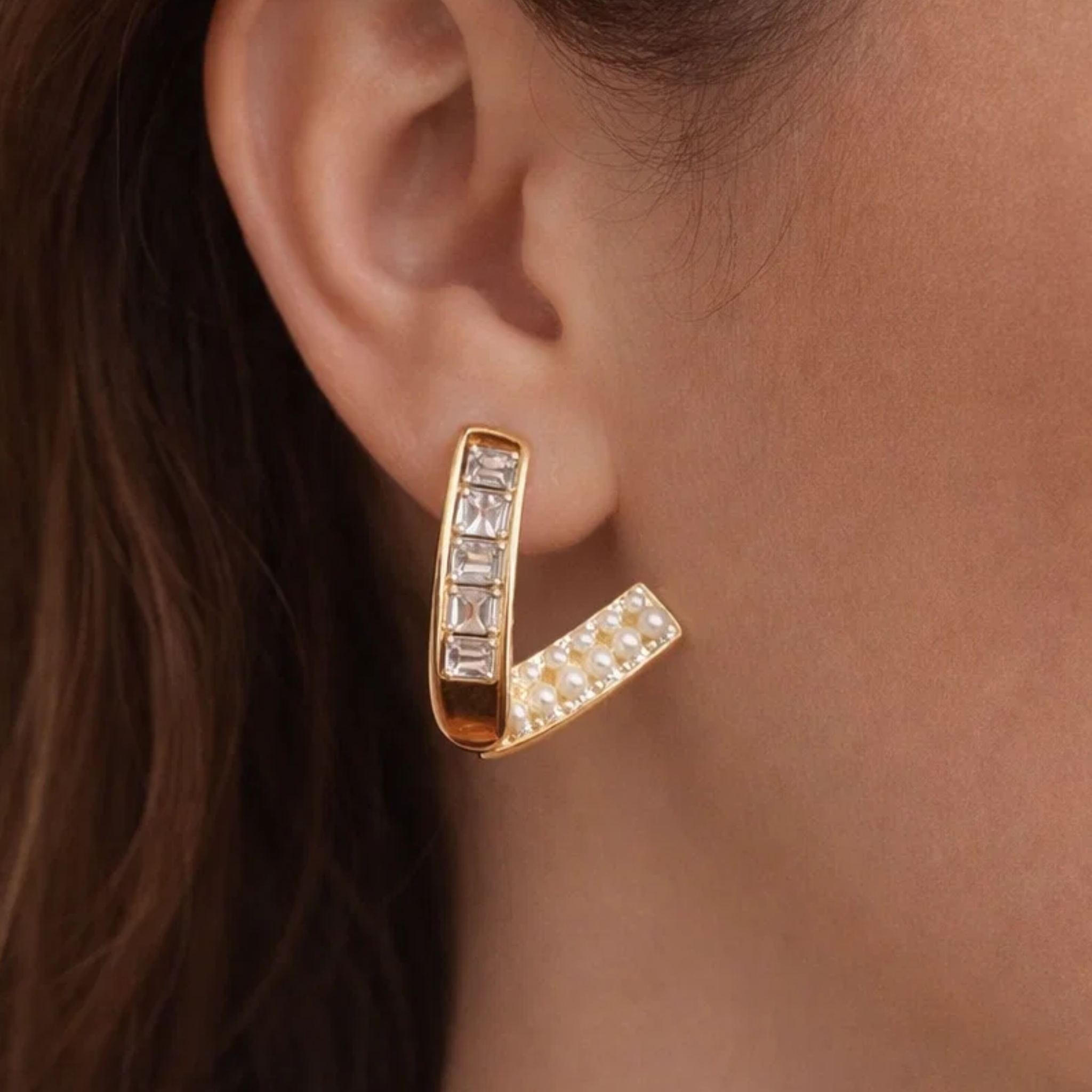 A woman wearing casual V earrings